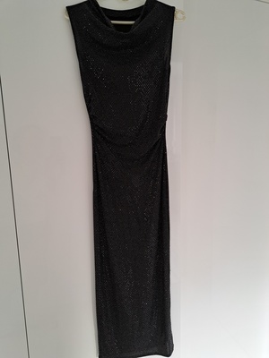 Elbląg Sprzedam sukienkę czarna błyszcząca, materiał elastyczny przylegający do ciała, rozm. xs