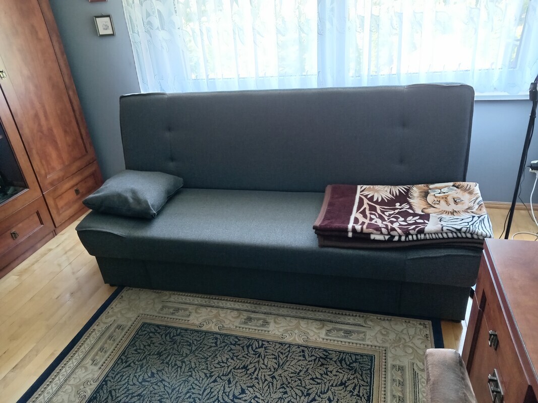 Elbląg Sprzedam nową wersalkę Tolia, z funkcją spania, duży pojemnik na pościel, szara, pow. spania 190 cm /115 cm.