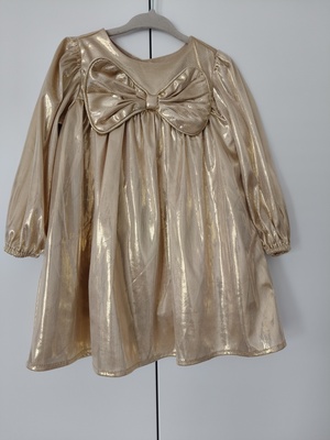 Elbląg Sprzedam piękną sukienkę w złotym kolorze w rozm. 86 z metki. Sukienka jest w bardzo dobrym stanie, użyta tylko