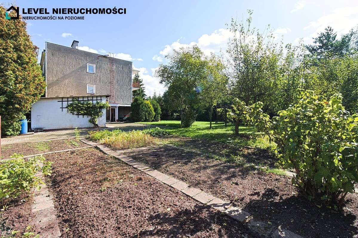 Elbląg LEVEL NIERUCHOMOŚCI  Dom na dużej działce w Elbląguplus dwa garażeul. Freta  NIERUCHOMOŚCI NA POZIOMIE